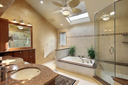 8792951 - modern master bath with glass shower and skylight